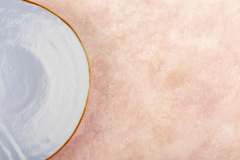 a top view blue round plate empty isolated on the pink background dish food table